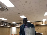 IMG 5319  Former Commissioner displays prototype of steel time capsule for cemeteries during planning meeting on September 13.